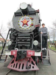 Hanging on to a now-retired Soviet train at the Tashkent Railway Museum.